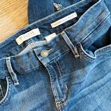 Load image into Gallery viewer, Upcycled from a collection of salvaged denim threads, including denim pants from a professional painter. Base jeans are from GUESS Womens size 27 fit, and in excellent condition! Some give/stretch denim with some intentional distress and random pockets. Added denim bits and pieces to create wide-flared bottoms. 