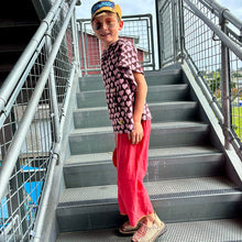 Load image into Gallery viewer, <p>Upcycled from salvaged vintage linen cotton curtain panels, dyed, and upcycled into these loose and flowy, wide leg pants/capri pants. We are all about comfort and versatility! Cord waist string, revealed stitching for color and whimsy. Cotton graphic tee with buck horn vibes.   </p> <p>Handcrafted with love and intention. </p> <ul> <li>Handmade in Santa Cruz, CA</li> <li>One-of-a-kind</li> <li>Size 7-9 youth (wide fit, can also work for bigger sizes as capri pants!</li> </ul>