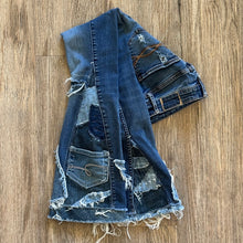 Load image into Gallery viewer, Upcycled from salvaged denim. Base jeans are from Abercrombie & Fitch Kids size 24 high rise (9/10), in great condition! Stretch denim with some intentional distress. Added denim bits and pieces, sashiko stitching for detail and embellishment, medium-flared bottoms. 
Handcrafted with love and intention.
One-of-a-kind
Fresh vibes
Size 24 kids (9/10)
Cold wash, like you would any pair of jeans, for longevity
Handmade in Santa Cruz, CA