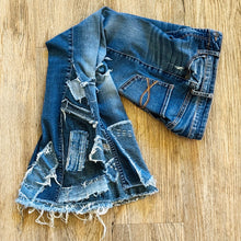 Load image into Gallery viewer, Upcycled from salvaged denim. Base jeans are from Abercrombie & Fitch Kids size 24 high rise (9/10), in great condition! Stretch denim with some intentional distress. Added denim bits and pieces, sashiko stitching for detail and embellishment, medium-flared bottoms. 
Handcrafted with love and intention.
One-of-a-kind
Fresh vibes
Size 24 kids (9/10)
Cold wash, like you would any pair of jeans, for longevity
Handmade in Santa Cruz, CA