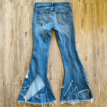 Load image into Gallery viewer, Upcycled from salvaged denim threads, and my own hand screen printed patch "BEcause the eARTh". Base jeans are from Pilcro and the Letterpress Womens size 27, and in great condition! Some give/stretch denim with some intentional distress. Added denim bits and pieces to create flared bottoms.
