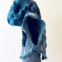 Load image into Gallery viewer, Upcycled from a collection of salvaged denim pants and a hand embroidered patch: BE YOUR OWN MUSE. Pow!! Oversized hoodie, sprinkles of sashiko stitching, random pockets, a lots of intentional distressed pieces, adding character and super urban vibes. Lightweight, with a gathering on the sides to keep a little fitted to your body. This piece is a perfect layer of warmth and FLY. 