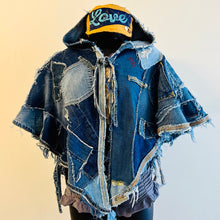 Load image into Gallery viewer, Upcycled from a collection of salvaged denim pants. Oversized hoodie, sprinkles of sashiko stitching, random pockets, a lots of intentional distress. Lightweight, with more denim for ties on the sides to keep a little fitted to your body. A perfect layer of warm and fresh. 
Handcrafted with love and intention.
Upcycled Capelet Jacket
Urban vibes
One-of-a-kind
All size
Handmade in Santa Cruz, CA