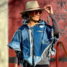 Load image into Gallery viewer, Upcycled from a collection of salvaged denim pants. Oversized hoodie, sprinkles of sashiko stitching, random pockets, a lots of intentional distress. Lightweight, with more denim for ties on the sides to be more fitting, or let loose and be more free flowing. A perfect layer of warm and fresh. 
Handcrafted with love and intention.
Upcycled Capelet Jacket
Urban vibes
One-of-a-kind
All size
Handmade in Santa Cruz, CA