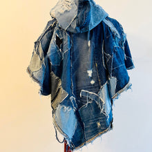 Load image into Gallery viewer, Upcycled from a collection of salvaged denim pants. Oversized hoodie, sprinkles of sashiko stitching, random pockets, a lots of intentional distress. Lightweight, with more denim for ties on the sides to keep a little fitted to your body. A perfect layer of warm and fresh. 
Handcrafted with love and intention.
Upcycled Capelet Jacket
Urban vibes
One-of-a-kind
All size
Handmade in Santa Cruz, CA