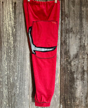 Load image into Gallery viewer, Upcycled from salvaged Juicy Couture french terry remnants and a cut from an organic cotton graphic tee. Super soft and cozy, and embellished with detail and revealed stitching! Elastic waistband with oversized pockets, for all those magical finds. 
Handcrafted with love and intention.
One-of-a-kind
Fly like an eagle vibes
Size 8T
Cold wash
Handmade in Santa Cruz, CA