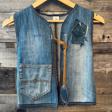 Load image into Gallery viewer, Upcycled from several denim jeans, salvaged Uroko t-shirt (local Santa Cruz clothing brand loving sea and scales), and love. A pocket for special little finds, and salvaged cord tie with detail.
Handcrafted with love and intention. 
Upcycled spirit vest
One-of-a-kind
Size 8-9 youth
Cold wash
Handmade in Santa Cruz, CA