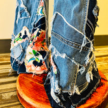 Load image into Gallery viewer, Upcycled from salvaged denim overalls, super colorful denim pants, and a lot of hand stitching and other denim scraps for embellishments and fun and unique detail. Base jeans are from American Rag Cie adult size 1 (XS/S adult), and in excellent condition! All intentional distress/rips that are significant have been also lined with fun fabric, so this piece is durable! Added amazing denim bits and pieces to create medium-flared bottoms. 