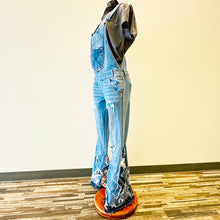 Load image into Gallery viewer, Upcycled from salvaged denim overalls, super colorful denim pants, and a lot of hand stitching and other denim scraps for embellishments and fun and unique detail. Base jeans are from American Rag Cie adult size 1 (XS/S adult), and in excellent condition! All intentional distress/rips that are significant have been also lined with fun fabric, so this piece is durable! Added amazing denim bits and pieces to create medium-flared bottoms. 