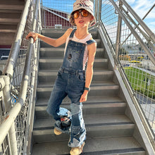 Load image into Gallery viewer, Upcycled from salvaged super stretch denim overalls, super colorful denim scraps, and hand stitching for added whimsy. More denim scraps as added embellishments and fun and unique detail. Base jeans are Cat & Jack, youth size 10/12, and in excellent condition! Intentional distress, fun denim bits and pieces fabric, this piece is super cute! Medium-flared bottoms. 