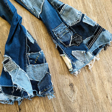 Load image into Gallery viewer, Upcycled from salvaged super stretch denim overalls, super colorful denim scraps, and hand stitching for added whimsy. More denim scraps as added embellishments and fun and unique detail. Base jeans are Cat & Jack, youth size 10/12, and in excellent condition! Intentional distress, fun denim bits and pieces fabric, this piece is super cute! Medium-flared bottoms. 