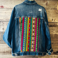 Load image into Gallery viewer, Upcycled from a salvaged denim youth jacket, and vintage Guatemalan tapestry. Intentional distress for super urban vibes, and eccentric and unique with gorgeous Guatemalan vibes on the back - a perfect layer of funky and FLY. 
Handcrafted with love and intention.
One-of-a-kind
Youth size 14-16 / XL
Handmade in Santa Cruz, CA