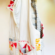 Load image into Gallery viewer, Upcycled from a cotton linen curtain, and adult cotton pants. Lined, with little details, pockets and a zipper. Whimsical, durable, a perfect layer of cozy and fun. 
Handcrafted with love and intention. 
Upcycled jacket vest
One-of-a-kind
Size 10-12 youth/ M
Cold wash
Handmade in Santa Cruz, CA