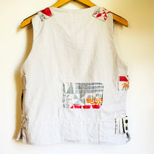 Load image into Gallery viewer, Upcycled from a cotton linen curtain, and adult cotton pants. Lined, with little details, pockets and a zipper. Whimsical, durable, a perfect layer of cozy and fun. 
Handcrafted with love and intention. 
Upcycled jacket vest
One-of-a-kind
Size 10-12 youth/ M
Cold wash
Handmade in Santa Cruz, CA
