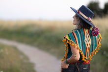 Load image into Gallery viewer, Upcycled from a 1930s Mexican Saltillo serape textile. This is very finely loom-woven wool, with exquisite, vibrant color, still in excellent condition. Lightweight, with added vintage dinge all fringe. A perfect layer of warmth and FLY. 
Handcrafted with love and intention.
Upcycled Capelet
Culturally exquisite vibes
One-of-a-kind
All size
Handmade in Santa Cruz, CA