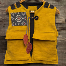 Load image into Gallery viewer, Upcycled from a cotton blend ladies skirt, cotton dress top and salvaged piece of vintage tapestry. Details, smock vibes, and revealed stitching for added whimsey and uniqueness. Two heavy duty pockets for all the magical finds, lined and a perfect layer of cozy and fresh. 
Handcrafted with love and intention. 
Upcycled spirit vest
One-of-a-kind
Size 8-10 youth
Cold wash, hang dry
Handmade in Santa Cruz, CA