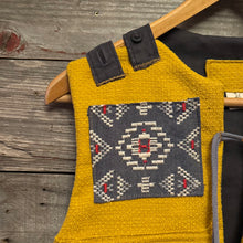 Load image into Gallery viewer, Upcycled from a cotton blend ladies skirt, cotton dress top and salvaged piece of vintage tapestry. Details, smock vibes, and revealed stitching for added whimsey and uniqueness. Two heavy duty pockets for all the magical finds, lined and a perfect layer of cozy and fresh. 
Handcrafted with love and intention. 
Upcycled spirit vest
One-of-a-kind
Size 8-10 youth
Cold wash, hang dry
Handmade in Santa Cruz, CA