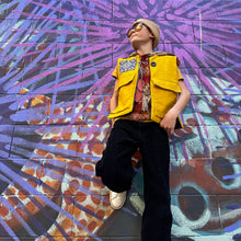 Load image into Gallery viewer, Upcycled from a cotton blend skirt, cotton top and salvaged vintage tapestry. Details, embellishments, revealed stitching and two large heavy duty pockets for added whimsey and uniqueness. Lined for warmth and durability, a perfect layer of cozy and fresh. 
Handcrafted with love and intention. 
Upcycled jacket vest
One-of-a-kind
Size 8-10 youth
Cold wash, hang dry
Handmade in Santa Cruz, CA