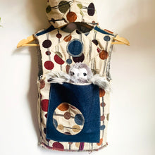 Load image into Gallery viewer, Upcycled from super fun upholstery scrap, lined with salvaged high end French Terry. Deep pockets in front and a backpack pocket in back made from remnant Selvedge Jean fabric. Oversized hoodie, button clasp, open neck for a cool breeze, and lots of whimsical detail.   * Owl not included. xoxo  Circles, and rectangles and lines OH MY Button clasp Comfortable layer of warmth - lined to keep your babe warm! One-of-a-kind Size 9-10 youth Handmade in Santa Cruz, CA Cold wash, hang dry