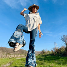 Load image into Gallery viewer, Upcycled from a collection of salvaged denim threads, including denim pants from a professional painter. Base jeans are from GUESS Womens size 27 fit, and in excellent condition! Some give/stretch denim with some intentional distress and random pockets. Added denim bits and pieces to create wide-flared bottoms.&nbsp;
