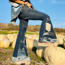 Load image into Gallery viewer, Upcycled from a collection of salvaged denim threads, including denim pants from a professional painter. Base jeans are from GUESS Womens size 27 fit, and in excellent condition! Some give/stretch denim with some intentional distress and random pockets. Added denim bits and pieces to create wide-flared bottoms.&nbsp;
