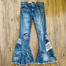 Load image into Gallery viewer, Upcycled from salvaged denim threads, and my own hand screen printed patch &quot;BEcause the eARTh&quot;. Base jeans are from Pilcro and the Letterpress&nbsp;Womens size 27, and in great condition! Some give/stretch denim with some intentional distress. Added denim bits and pieces to create flared bottoms.
