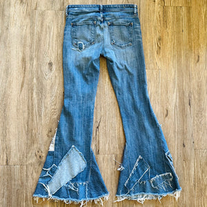 Upcycled from salvaged denim threads, and my own hand screen printed patch "BEcause the eARTh". Base jeans are from Pilcro and the Letterpress&nbsp;Womens size 27, and in great condition! Some give/stretch denim with some intentional distress. Added denim bits and pieces to create flared bottoms.