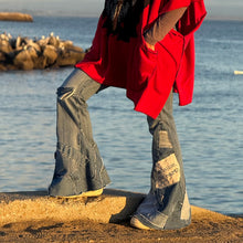 Load image into Gallery viewer, Upcycled from salvaged denim threads, and my own hand screen printed patch &quot;BEcause the eARTh&quot;. Base jeans are from Pilcro and the Letterpress&nbsp;Womens size 27, and in great condition! Some give/stretch denim with some intentional distress. Added denim bits and pieces to create flared bottoms.
