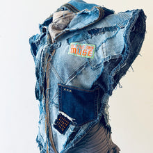 Load image into Gallery viewer, Upcycled from a collection of salvaged denim pants and a hand embroidered patch: BE YOUR OWN MUSE. Pow!! Oversized hoodie, sprinkles of sashiko stitching, random pockets, a lots of intentional distressed pieces, adding character and super urban vibes. Lightweight, with a gathering on the sides to keep a little fitted to your body. This piece is a perfect layer of warmth and FLY.&nbsp;
