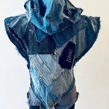 Load image into Gallery viewer, Upcycled from a collection of salvaged denim pants and a hand embroidered patch: BE YOUR OWN MUSE. Pow!! Oversized hoodie, sprinkles of sashiko stitching, random pockets, a lots of intentional distressed pieces, adding character and super urban vibes. Lightweight, with a gathering on the sides to keep a little fitted to your body. This piece is a perfect layer of warmth and FLY.&nbsp;
