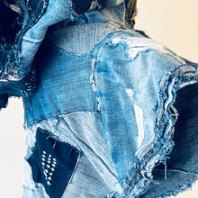 Load image into Gallery viewer, Upcycled from a collection of salvaged denim pants and a hand embroidered patch: BE YOUR OWN MUSE. Pow!! Oversized hoodie, sprinkles of sashiko stitching, random pockets, a lots of intentional distressed pieces, adding character and super urban vibes. Lightweight, with a gathering on the sides to keep a little fitted to your body. This piece is a perfect layer of warmth and FLY.&nbsp;
