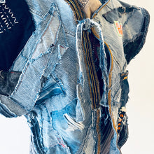 Load image into Gallery viewer, Upcycled from a collection of salvaged denim pants and a hand embroidered patch: BE YOUR OWN MUSE. Pow!! Oversized hoodie, sprinkles of sashiko stitching, random pockets, a lots of intentional distressed pieces, adding character and super urban vibes. Lightweight, with a gathering on the sides to keep a little fitted to your body. This piece is a perfect layer of warmth and FLY.&nbsp;
