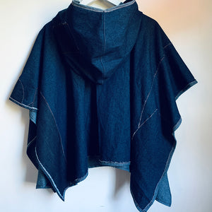 Upcycled from salvaged, super yummy, lightweight denim scraps, and a vintage Iranian tapestry. Lightweight and flowy, with oversized hoodie. Intentional raw edges, and revealed stitching, this beautiful poncho is perfectly imperfect and ready to be worn as another layer of love and flare.   Handcrafted with love and intention.  Upcycled poncho Vintage Iranian tapestry Denim patchwork vibes One-of-a-kind Oversized hooded poncho Handmade in Santa Cruz, CA