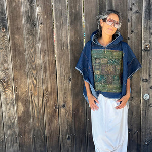 Upcycled from salvaged, super yummy, lightweight denim scraps, and a vintage Iranian tapestry. Lightweight and flowy, with oversized hoodie. Intentional raw edges, and revealed stitching, this beautiful poncho is perfectly imperfect and ready to be worn as another layer of love and flare.   Handcrafted with love and intention.  Upcycled poncho Vintage Iranian tapestry Denim patchwork vibes One-of-a-kind Oversized hooded poncho Handmade in Santa Cruz, CA