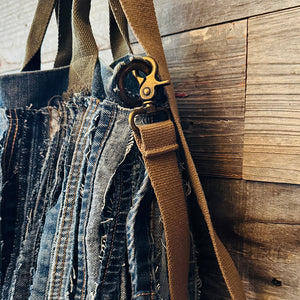 Upcycled from a whole lotta salvaged denim scraps, carefully sewn onto a salvaged denim bag with one interior pocket. This bag has both hand straps, as well as a shoulder strap for versatility! Not only are you choosing eco conscious with using textiles saved from the landfill, this bag is super unique and fly! DENIM DENIM DENIM!

Handcrafted with love and intention.

One-of-a-kind
Denim vibes

Handmade in Santa Cruz, CA