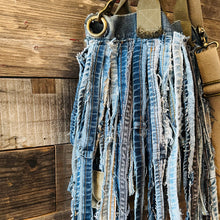 Load image into Gallery viewer, Upcycled from a whole lotta salvaged denim scraps, carefully sewn onto a salvaged denim bag with one interior pocket. This bag has both hand straps, as well as a shoulder strap for versatility! Not only are you choosing eco conscious with using textiles saved from the landfill, this bag is super unique and fly! DENIM DENIM DENIM!

Handcrafted with love and intention.

One-of-a-kind
Denim vibes

Handmade in Santa Cruz, CA
