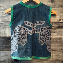 Load image into Gallery viewer, Upcycled from denim jeans, Sure Design cotton tee, and vintage specialty silk. Intentional distress, revealed stitching, pockets for treasures, with whimsical detail.&nbsp;

Hand crafted with love and intention.

Denim and button clasp
One-of-a-kind
Size 8-9 youth
Cold wash
Handmade in Santa Cruz, CA
