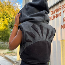 Load image into Gallery viewer, Upcycled from fleece remnant fabric. Oversized hoodie and sunrise vibes.&nbsp;

Handcrafted with love and intention.&nbsp;

Upcycled&nbsp;spirit vest
One-of-a-kind
Size 8-10 youth

Cold wash
Handmade in Santa Cruz, CA
