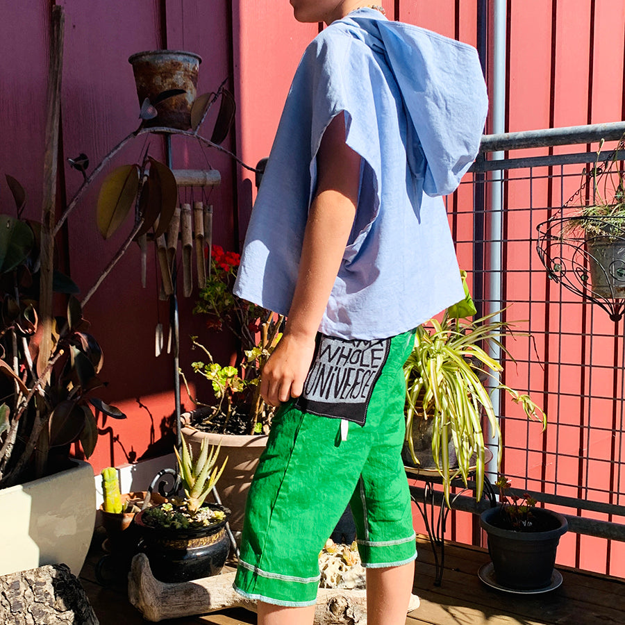 Upcycled from salvaged cotton blend dress, and an IRIECYCLE linocut block print patch on cotton tee for pocket. This fabric has a bit of stretch to it, so its perfect for play and movement! Cord waist string, revealed stitching for color and whimsy. Capris length vibes.   