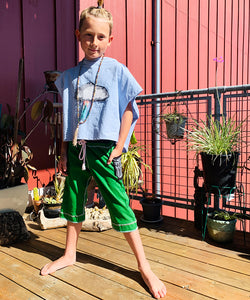 Upcycled from salvaged cotton blend dress, and an IRIECYCLE linocut block print patch on cotton tee for pocket. This fabric has a bit of stretch to it, so its perfect for play and movement! Cord waist string, revealed stitching for color and whimsy. Capris length vibes.&nbsp; &nbsp;