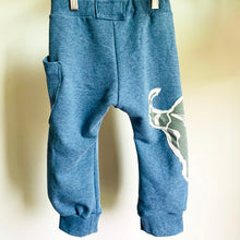 Load image into Gallery viewer, Upcycled from a super soft L.L. Bean cotton blend robe, and a graphic tee. These pants are made for play, incredibly soft and not to thin that a hole will appear in a little fall. Perfect lightweight layer of love on your little one&#39;s bottoms!  Handcrafted with love and intention.  One-of-a-kind Size 2T  Cow skull vibes Side pocket for special treasures Handmade in Santa Cruz, CA
