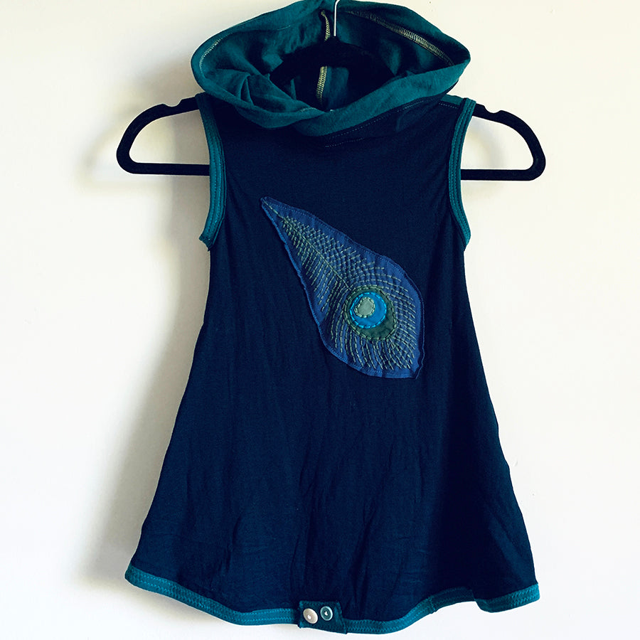 Upcycled from organic cotton remnant scrap and a Synergy Organic embroidered patch. Super comfortable, extremely soft and cozy, with an oversized hoodie for that extra layer of warmth.   Handcrafted with love and intention.   Upcycled sleeveless dress One-of-a-kind Peacock vibes Handmade in Santa Cruz, CA