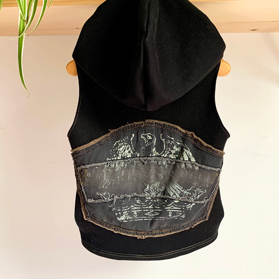 Upcycled from adult cotton hoodie, a Spiritual Gangster graphic tee, and salvaged eagle graphic from an adult jacket. Drawstring cord on hood, two side pockets for little tiny hands and finds...a super cute little layer of love and warrior vibes.