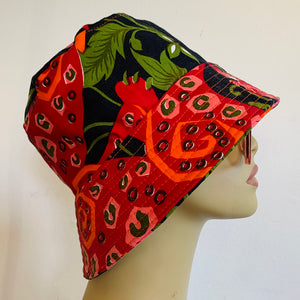 Indian dress upcycled into this reversible bucket hat. Each side uses different parts of the garmet, so that each has its own vibe - one with butterfly and flowers, the other tiger and tiger abstract spots. Midweight interfacing so the brim is a bit stiffer on this one.