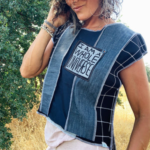 Upcycled from several dress pants, selvedge denim scraps, little bit of embellishing  with colorful stitching and a salvaged button, and an IRIECYCLE hand screen printed patch: I AM A WHOLE UNIVERSE! Artsy vibes, revealed stitching, longer in the back.     Handcrafted with love and intention.   One-of-a-kind Unique cut and vibes Handmade in Santa Cruz, CA