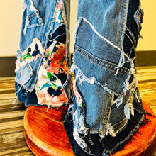 Load image into Gallery viewer, Upcycled from salvaged denim overalls, super colorful denim pants, and a lot of hand stitching and other denim scraps for embellishments and fun and unique detail. Base jeans are from&nbsp;American Rag Cie adult size 1 (XS/S adult), and in excellent condition! All intentional distress/rips that are significant have been also lined with fun fabric, so this piece is durable! Added amazing denim bits and pieces to create medium-flared bottoms.&nbsp;
