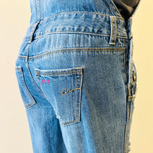 Load image into Gallery viewer, Upcycled from salvaged denim overalls, super colorful denim pants, and a lot of hand stitching and other denim scraps for embellishments and fun and unique detail. Base jeans are from&nbsp;American Rag Cie adult size 1 (XS/S adult), and in excellent condition! All intentional distress/rips that are significant have been also lined with fun fabric, so this piece is durable! Added amazing denim bits and pieces to create medium-flared bottoms.&nbsp;
