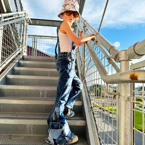 Upcycled from salvaged super stretch denim overalls, super colorful denim scraps, and hand stitching for added whimsy. More denim scraps as added embellishments and fun and unique detail. Base jeans are Cat &amp; Jack, youth size 10/12, and in excellent condition! Intentional distress, fun denim bits and pieces fabric, this piece is super cute! Medium-flared bottoms.&nbsp;