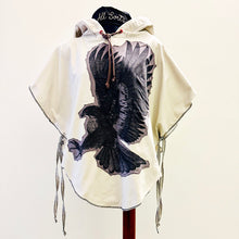 Load image into Gallery viewer, Upcycled from cotton lightweight canvas curtain and a salvaged Sure Design cotton t-shirt. Intentional revealed stitching, hand embroidered stitching for extra detail and whimsy, an oversized hood and side ties to give the option of more fitting or free flowing.

This poncho is lightweight, super cozy and total vibes for that walk along the beach, on your way to yoga class, or even out to dinner with your bestie! Easily rolls up so you can bring that extra layer of warm and fly with you anywhere!!!
