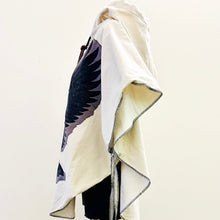 Load image into Gallery viewer, Upcycled from cotton lightweight canvas curtain and a salvaged Sure Design cotton t-shirt. Intentional revealed stitching, hand embroidered stitching for extra detail and whimsy, an oversized hood and side ties to give the option of more fitting or free flowing.

This poncho is lightweight, super cozy and total vibes for that walk along the beach, on your way to yoga class, or even out to dinner with your bestie! Easily rolls up so you can bring that extra layer of warm and fly with you anywhere!!!
